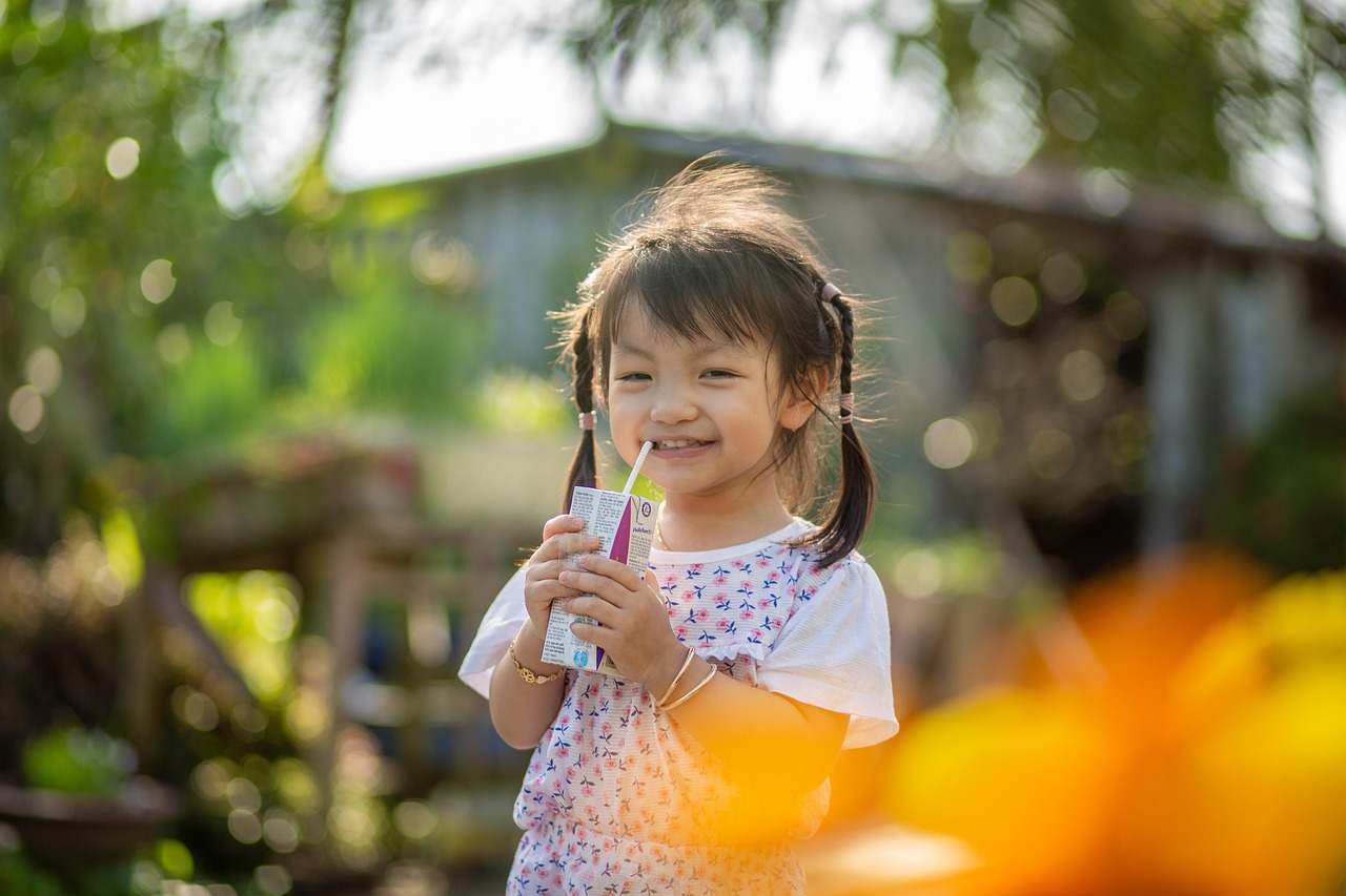 Child enjoying a quiet drink outside at home